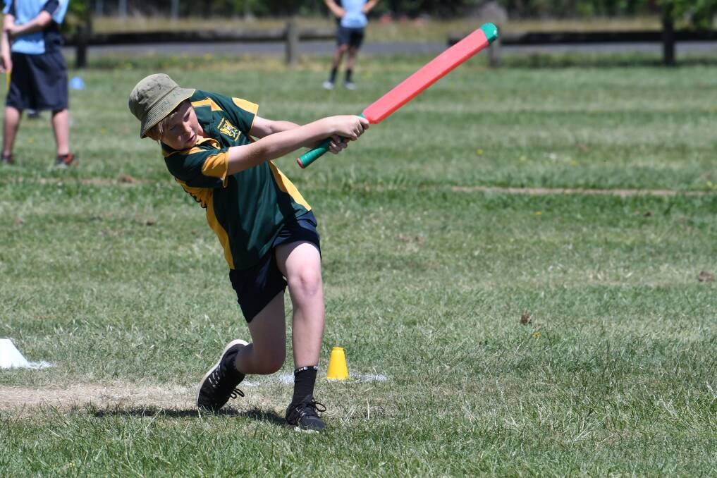 SLOG: Ararat West Primary School's Jack lines up a big shot during the T20 blast event in Ballarat on Wednesday. Picture: Kate Healy