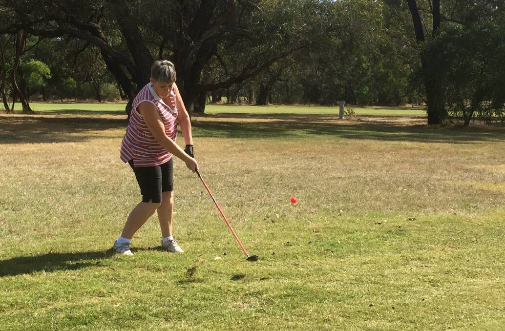 CHIP: Judy Edwards takes a shot during the four ball best ball event at Chalambar Golf Club on Wednesday. Picture: Gayle Dadswell