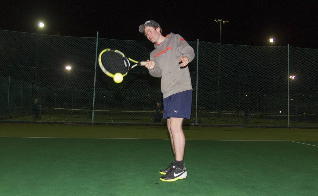 BALANCED: Ben Hartwich lines up a forehand during an early season match of the Wednesday night tennis competition. Picture: Peter Pickering
