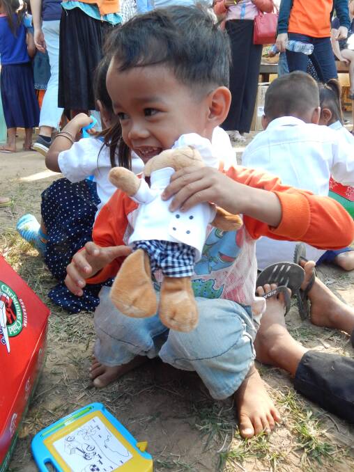 CHRISTMAS SPIRIT: The Samaritan's Purse campaign delivered gift-filled shoe boxes and plenty of smiles to children in Cambodia during Christmas last year. Picture: CONTRIBUTED