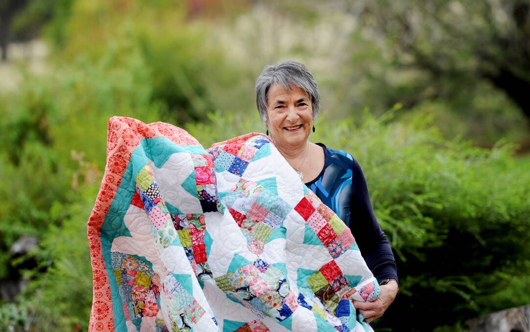 TIME FOR TEA: Laharum Biggest Morning Tea co-ordinator Liz Hopkins with a quilt that will be raffled at the event. Picture: SAMANTHA CAMARRI