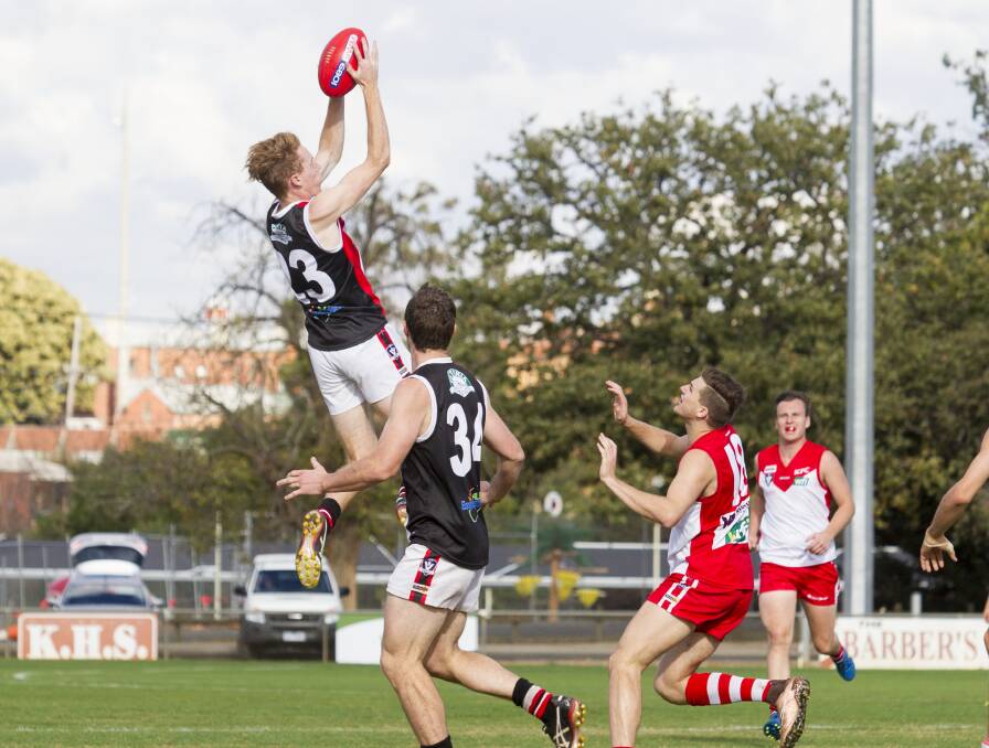 LEAP OF FAITH: Horsham Saint Hugh Gove shows his acrobatic skills in the round five clash between Saints and Ararat. Picture: PETER PICKERING