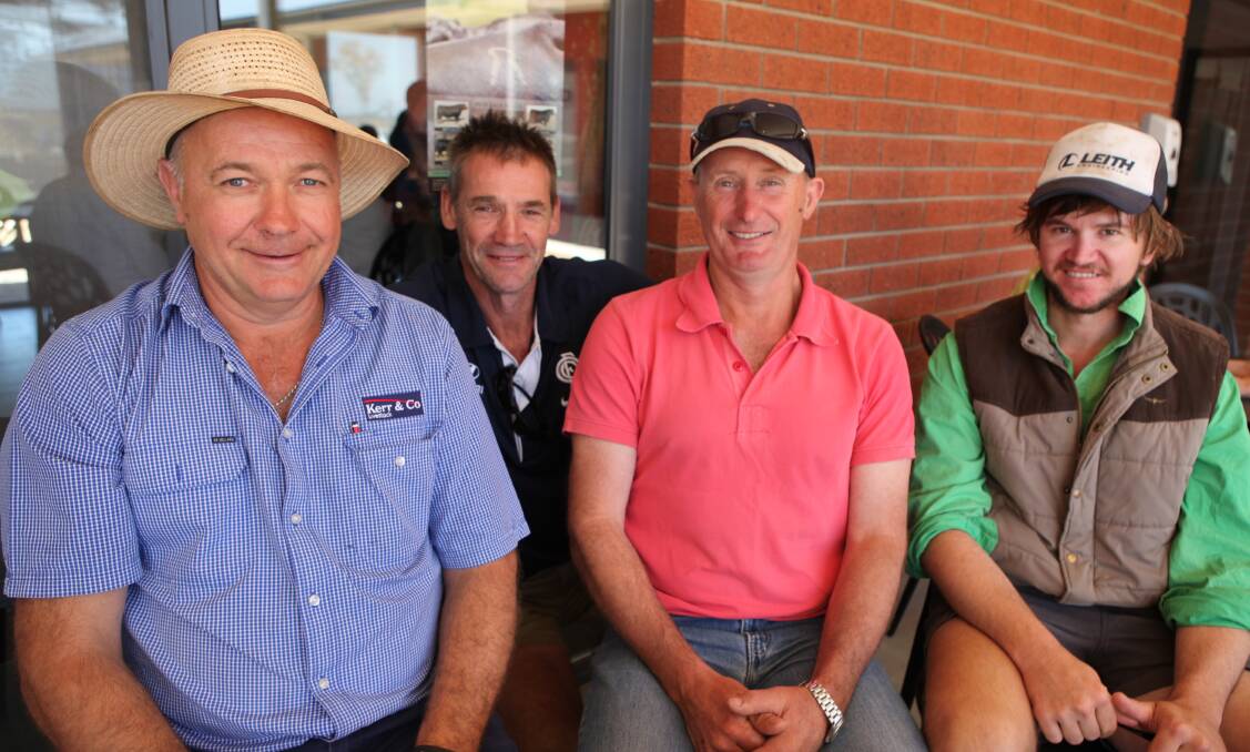 Trying it out: At the opening of the new saleyards are stock agent John Uebergang and vendors Bradley Bensch, back, of Tarrington and Darren and Dylan Rentsch of Penshurst.