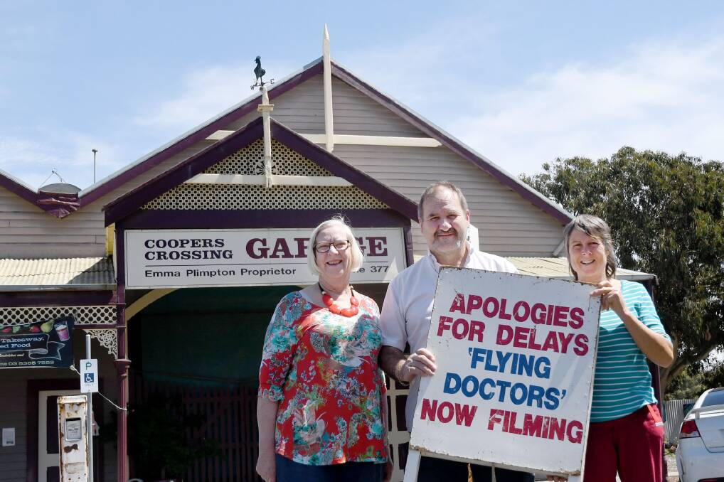 Minyip's Shirley Smith, AJ Niewand and Corinne Heintze in front of Emma's Garage, which featured in The Flying Doctors. Picture: SAMANTHA CAMARRI