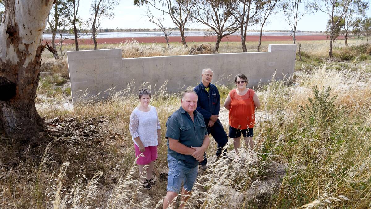 Natimuk Lake Foreshore Committee members Sally Wicks, Rob Ellis, Keith Haustorfer and Jenny Fraser with the unfinished outlet spillway at Natimuk Lake. Picture: SAMANTHA CAMARRI