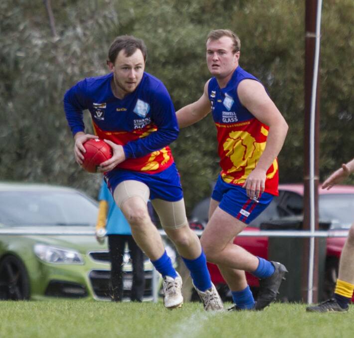 CARRY: Josh McCartney runs with the ball for Great Western in its loss to Hawkesdale-Macarthur. The Lions have lost their past seven Mininera District Football League games. Picture: Peter Pickering. 