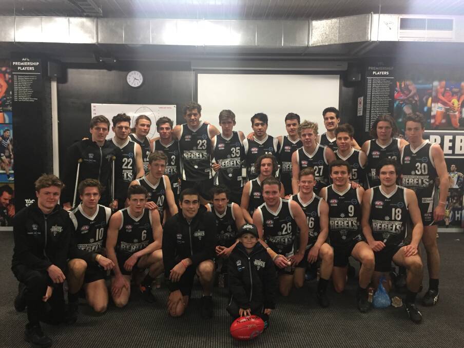 PART OF THE TEAM: Ethan with the GWV Rebels, including Stawell's Jackson Taurau and Naish McRoberts. He was chaperoned on the day by first-year Rebel Josh Chatfield as a 'Rebel for the day'. Picture: Contributed. 