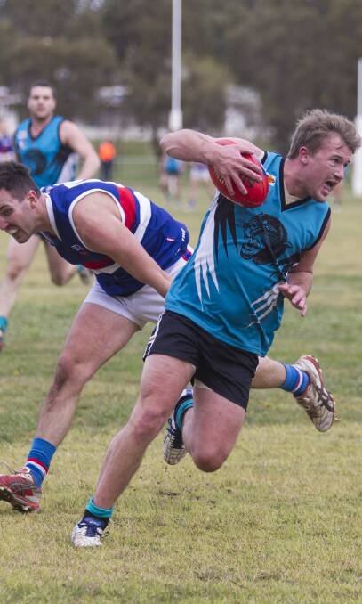 Too quick: Moyston/Willaura forward Aidan Bell evades his SM&W Rovers opponent during last week's big 73-point win over the Bulldogs. Pictures: Peter Pickering
