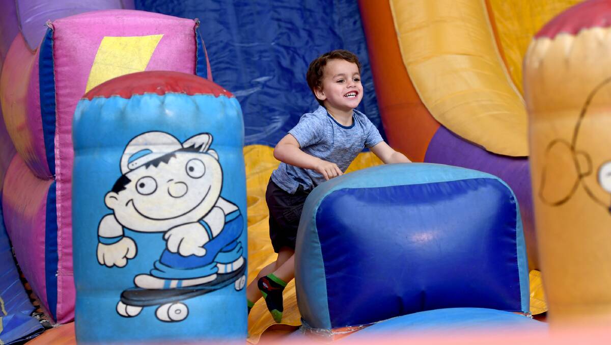 SHOWTIME FUN: Aiden Suter, 4, of Horsham, plays on the jumping castle during the Nhill Show on Thursday. Picture: SAMANTHA CAMARRI