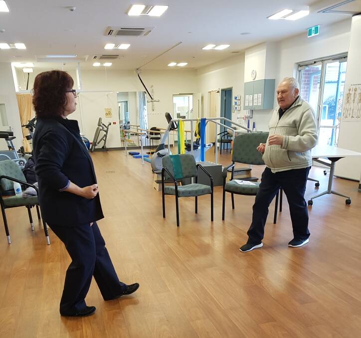 TREATMENT: Allied health assistant Nicole Nicholson helps Stawell resident Roger Phillis following the completion of his active cancer treatment. 