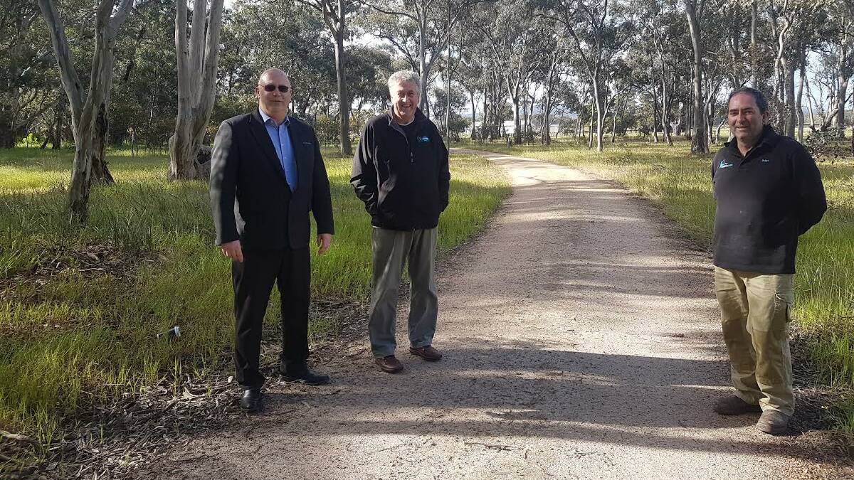 PLANS: StawellBiz president Nigel Keating, Northern Grampians Councillor Murray Emerson and Peter Carey want to open the rail trail. Picture: ANTHONY PIOVESAN 