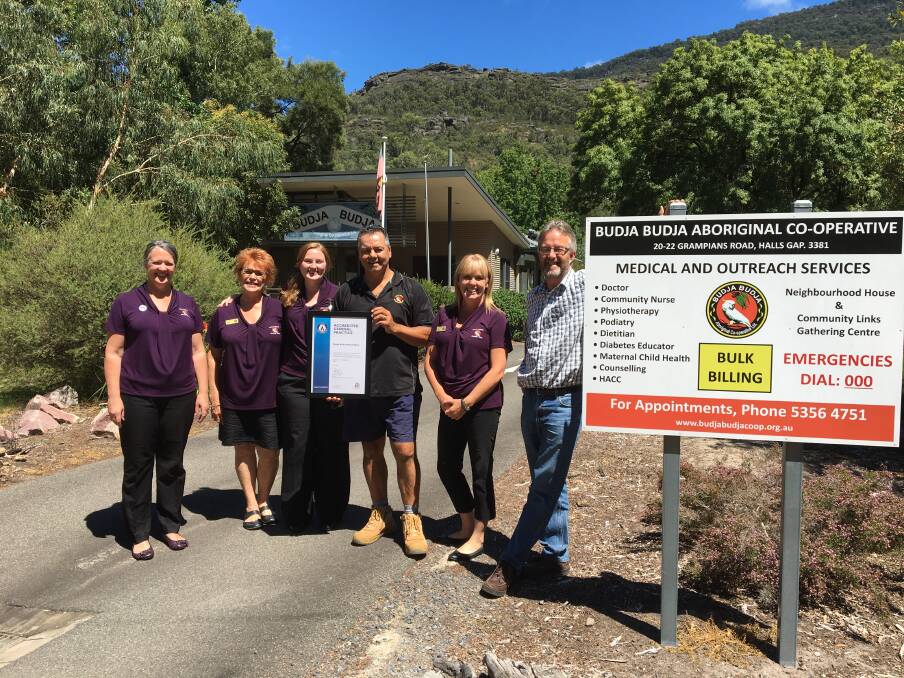 COMMITTED: The team at Budja Budja medical clinic display their accreditation which was awarded by Australian General Practice Accreditation Limited earlier this year. 