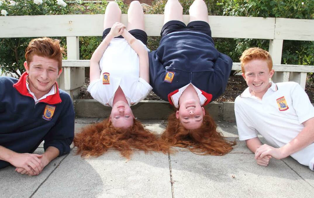 GINGER PRIDE: Stawell Secondary College students Heather, Kaylee and Bayley show off their red roots everyday, but will especially on Sunday. Picture: Peter Pickering