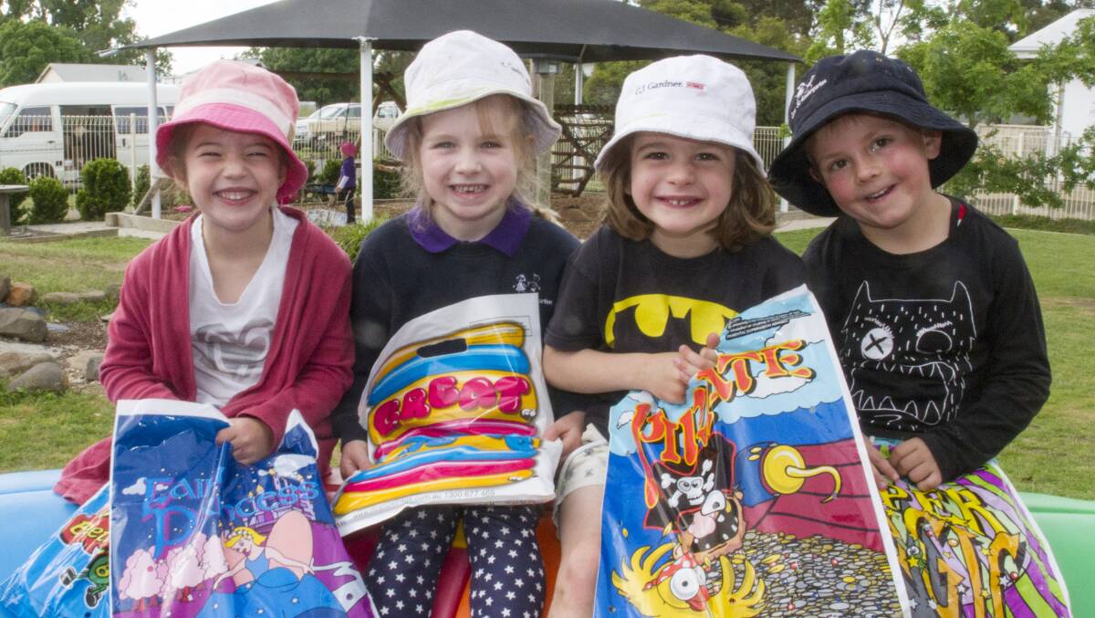 Carey St Kinder students Isabella, Ella, Judd and Kobe can't wait for their kindergarten's Springtime Fair on Friday. Picture: PETER PICKERING