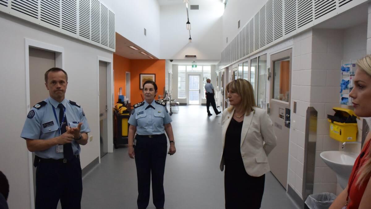 Hopkins Correctional Centre general manager Scott Jacques and Corrections Victoria Commissioner Jan Shuard lead Corrections Minister Gayle Tierney on a tour of the prison's secure medical area in 2017. Picture: REX MARTINICH