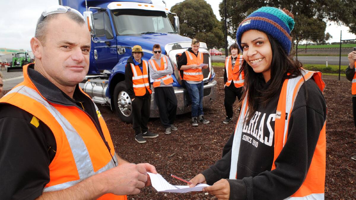 William Adams CAT Horsham branch manager Rodney Hogan, checks the work of Horsham College ConnectEd student  Justine Taylor-Campbell, age 17. Picture: PAUL CARRACHER

