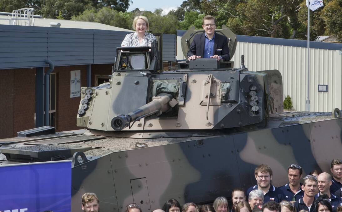 Ripon MP Louise Staley and AME Systems managing director Nick Carthew in the turret of a BAE Systems AMV35 armoured vehicle. BAE will select AME Systems for a major electrical wiring contract if it wins an army vehicle bid. Picture: PETER PICKERING
