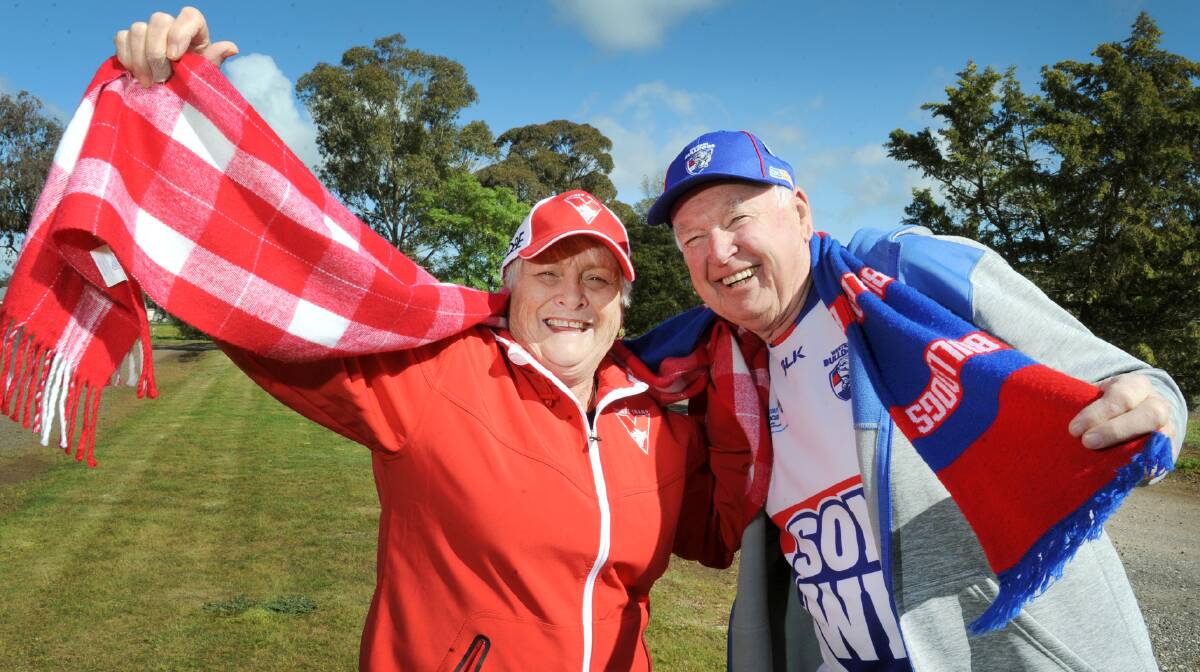 RIVALRY: Sydney Swans supporter Jan Johnson and Bulldogs supporter Ron Johnson are excited for their teams to go head-to-head. Picture: PAUL CARRACHER 