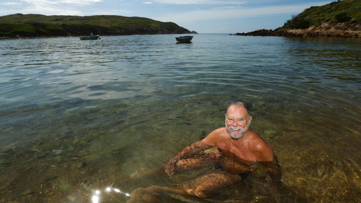 Author and long-time visitor to Broughton Island, John "Stinker" Clarke, in the water at Esmeralda Cove. Picture: Jonathan Carroll