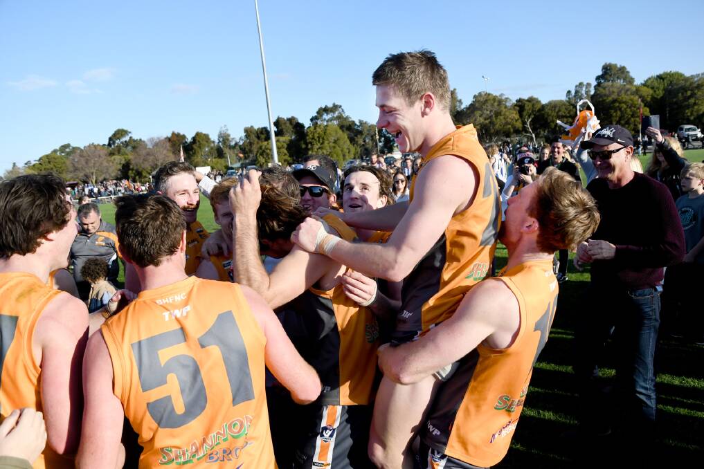 ON THE MOVE AGAIN? Southern Mallee Giants celebrate after winning last season's Horsham district grand final. Picture: SAMANTHA CAMARRI