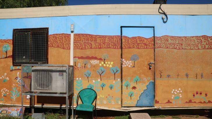 Mural showing MacDonnell Ranges just behind the camp.
 Photo: Louise Southerden