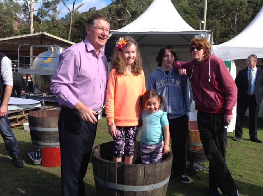 Victorian Premier, Dr Denis Napthine with Olivia and Evie, while Josh and Rhys look on at the Grape Stomp.