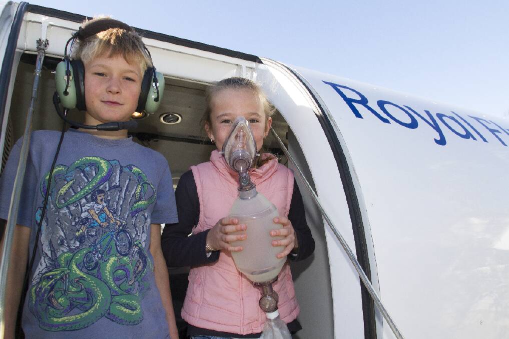Sam and Madele on the steps of the Royal Flying Doctor Service aero-medical simulator when it visited Maroona Primary School.