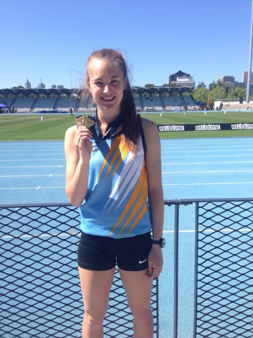 Sarah Blizzard with her two gold medals from the Victorian All Schools Track and Field Championships earlier this month. Picture: SUE BLIZZARD