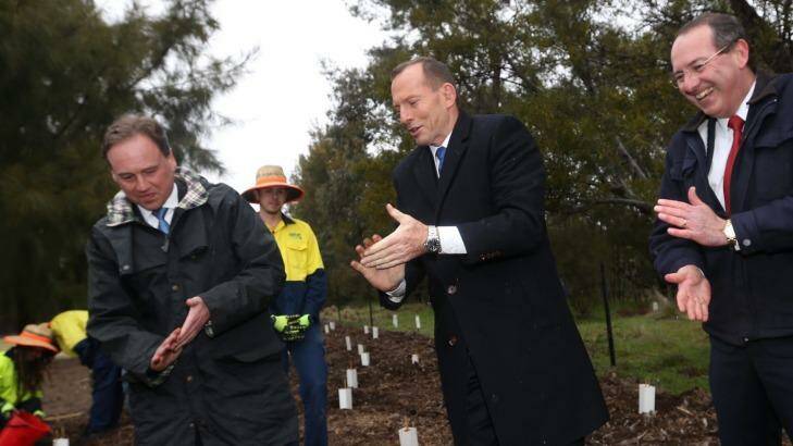 Tony Abbott, Greg Hunt and former MP Peter Hendy at a Green Army project site this year. Photo: Andrew Meares