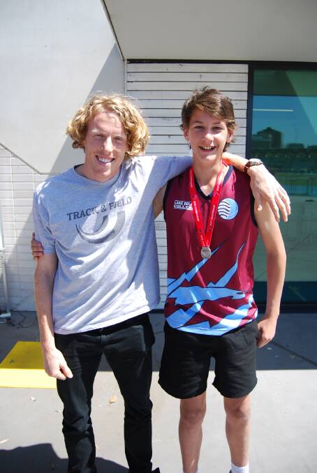 Lake Bolac College's Pat Graham claimed a silver medal in the javelin at the School Sport Victoria secondary track and field championships last week. Here he is celebrating his success alongside Olympic gold medalist Steve Hooker. Picture: CONTRIBUTED