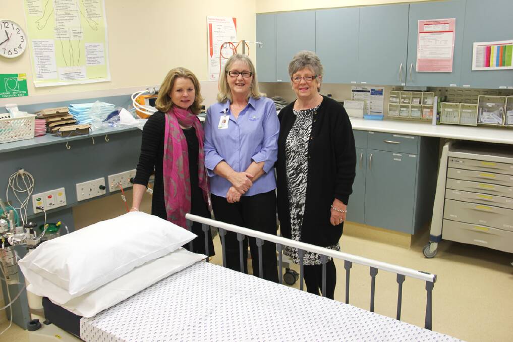 Therese Jess, Lorine Paterson and Kathy Lewis with one of the new urgent care beds.