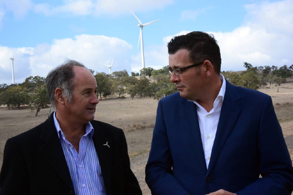 Victorian Premier Daniel Andrews discusses the renewable energy announcement with Ararat Rural City Mayor Cr Paul Hooper at the Challicum Hills Wind Farm on Friday. Picture: SAM SHALDERS