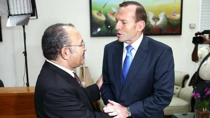 Tony Abbott shakes the hand of his PNG counterpart Peter O'Neill in March. Photo: Alex Ellinghausen