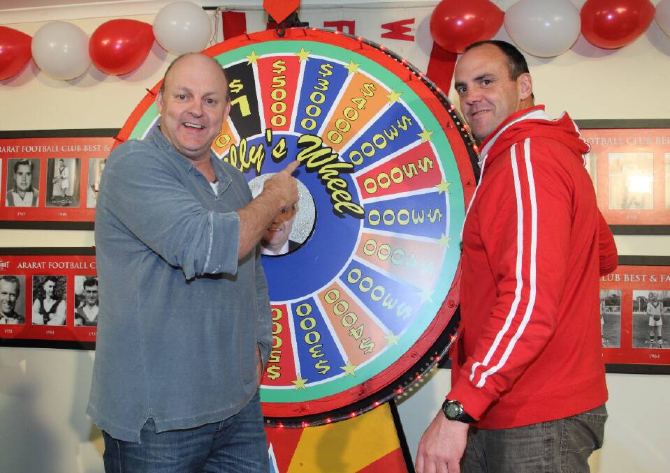 Billy Brownless and Scott Turner ready the wheel for The Footy Show’s live 
cross to Ararat last week. 