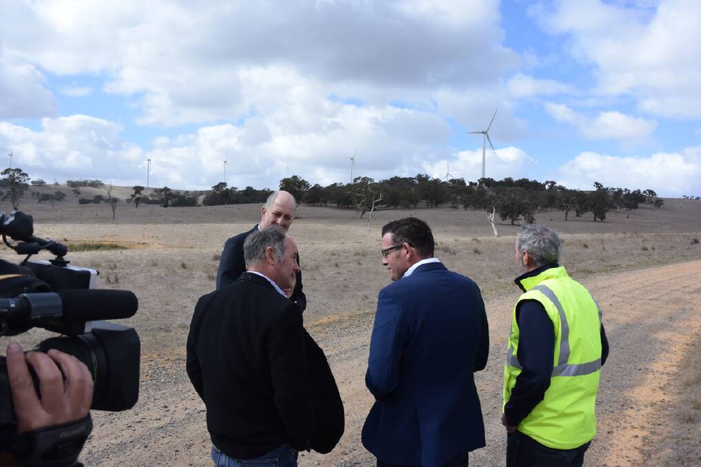 Victorian Premier Daniel Andrews discusses the renewable energy annoucement with Ararat Rural City mayor Paul Hooper at the Chullicum Hills Wind Farm on Friday. Picture: SAM SHALDERS