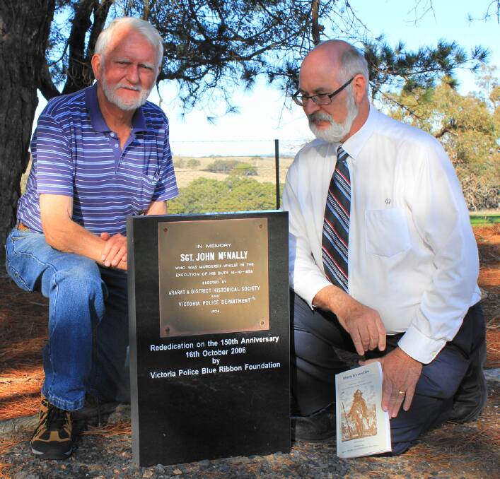 Author Laurie Moore with Ian Batty, president of the Ararat Genealogical Society, at the memorial in Cathcart Cemetery.