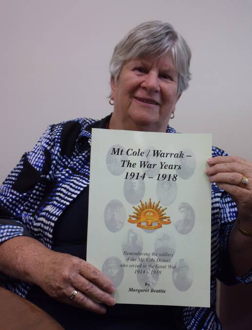 Margaret Beattie with her book on the war history of the Warrak and Mount Cole areas. Picture: JODIE HOLWELL