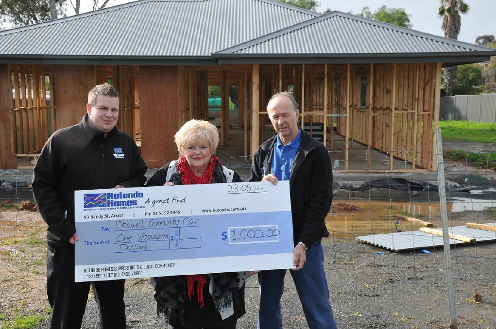 Hotondo Homes Ararat sales manager Joel Spence (left) and manager Russell
Pearse with Grampians Community Health Community Car co-ordinator Joy
McCracken.