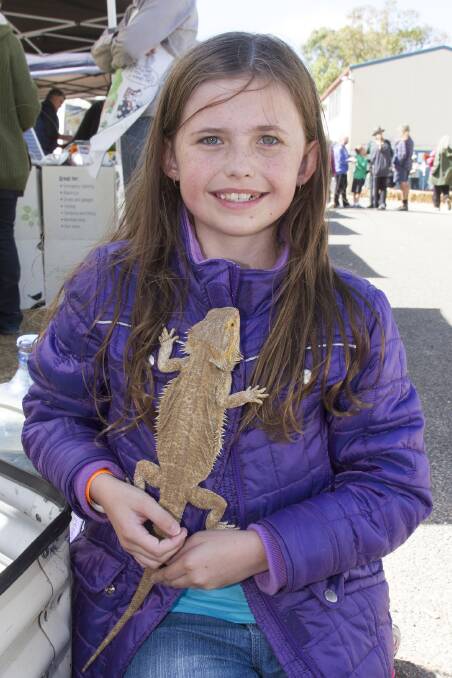 Teah enjoyed getting up close to this bearded dragon at the Lake Bolac Eel Festival. Picture: PETER PICKERING