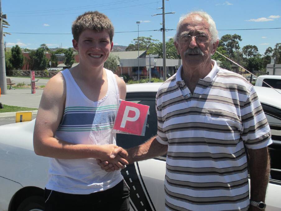 Brad Wood receives his P plates from mentor Ron.