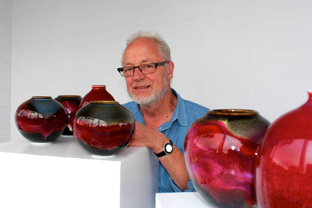 Artist John Eagle with some of the pots being auctioned to raise funds for Marian College teacher Tess Tonks.