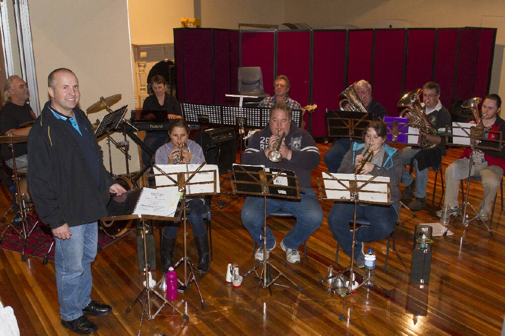 Musical director Wally Pope with The Witches of Eastwick band. Picture: PETER PICKERING