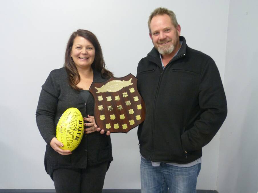 Barkley Vincent (right), one of the organisers of the Turner-Pickering Challenge presents Ararat and District Junior Football Association president Liesa Iezekil with the winning shield. Ms Iezekil also accepted a football which has been signed by all the representatives of the challenge on behalf of Scott Turner who coached the Ararat team.