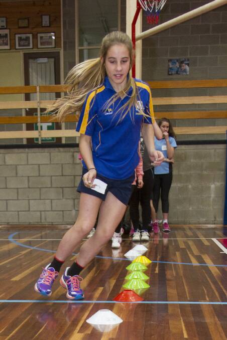 Karly tackles the obstacle course during the school holiday clinic.