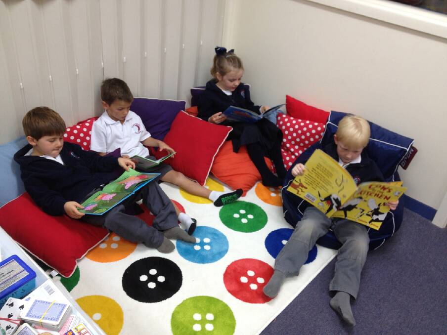 Prep Students enjoying their brand new reading corner, Braden, Sam, Lily and Cooper.