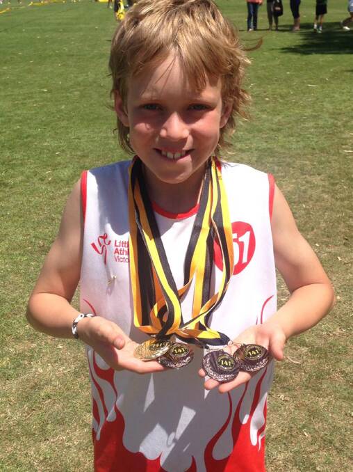 Ararat Little Athletics member Keelan Perry with his medal haul from the recent Rochester Open Day.