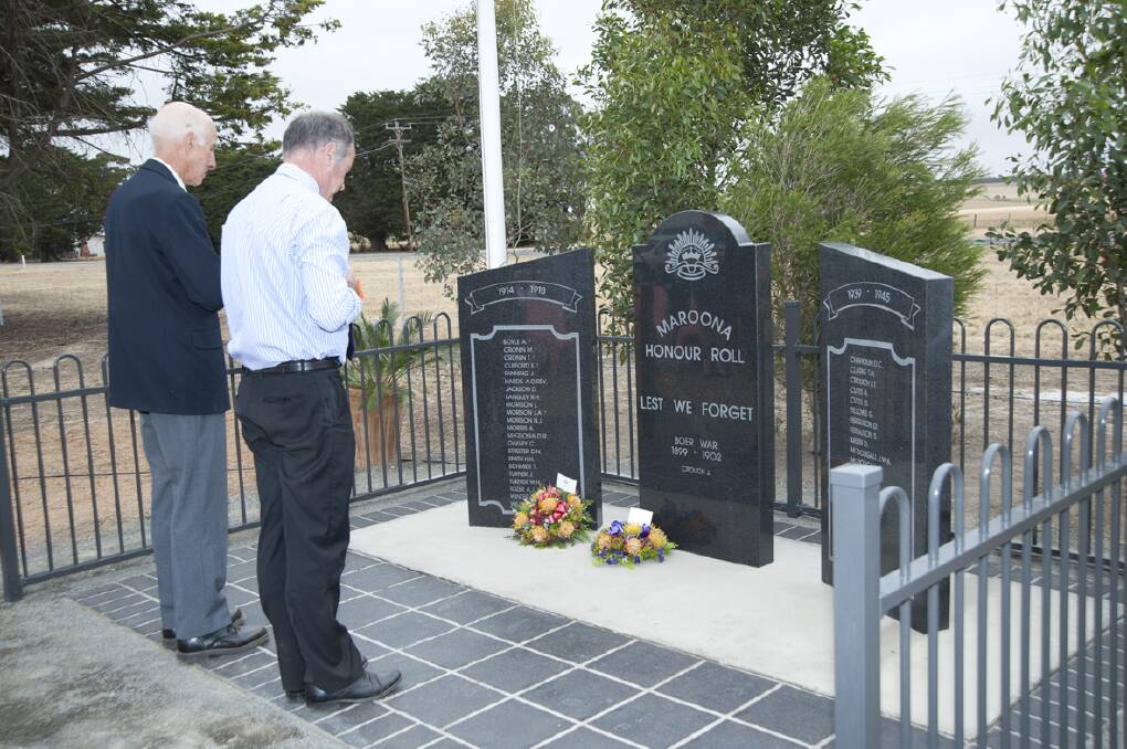 Ararat Rural City’s Cr Colin McKenzie and Mayor Cr Paul Hooper pay their respects at the new memorial.
