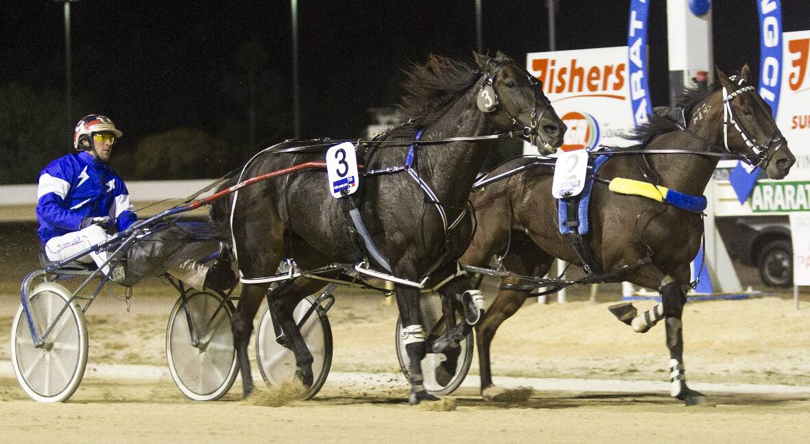 The Keith Cotchin-trained Road to Rock wins the 2015 Renown Silverware Ararat Pacing Cup on Saturday night with Nathan Jack at the helm. Picture: PETER PICKERING