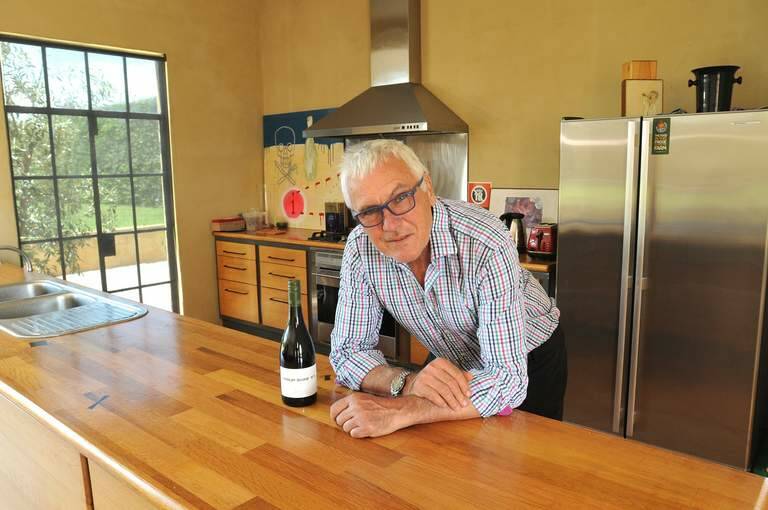 Winemaker Philip Shaw in his home, which is surrounded by his vineyards in Orange NSW. All the joinery is made from oak vats. Photo: Steve Gosch