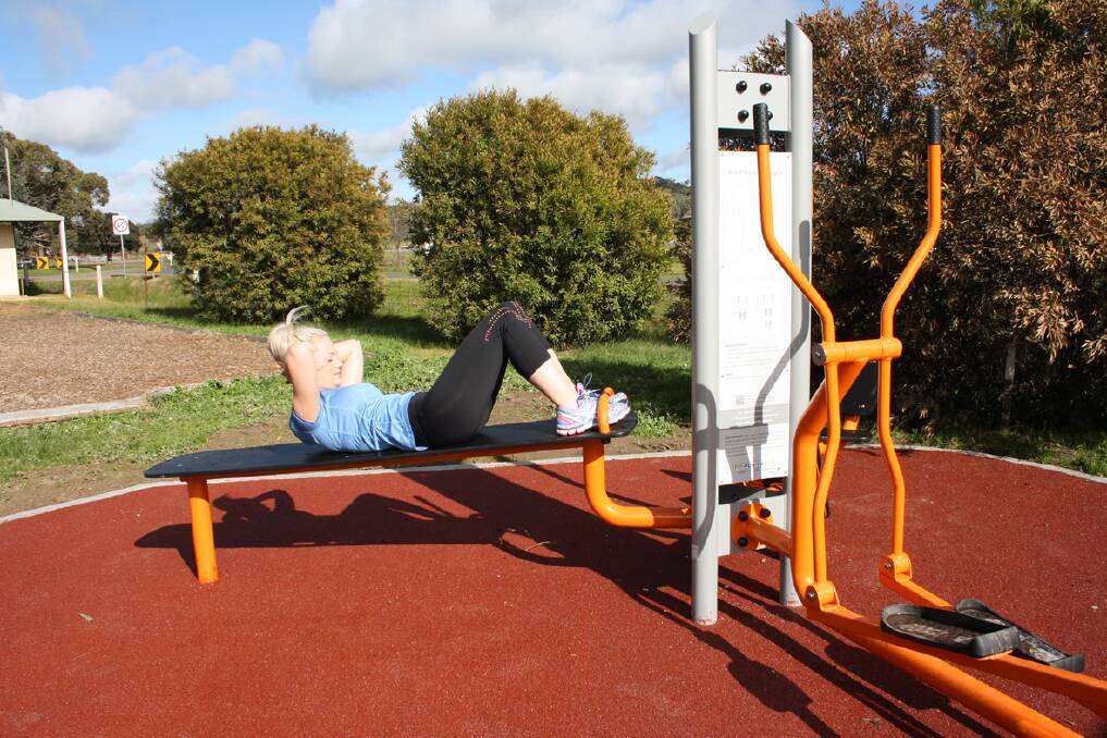 Jade Randall demonstrates how to use the equipment installed at Moyston for sit ups.